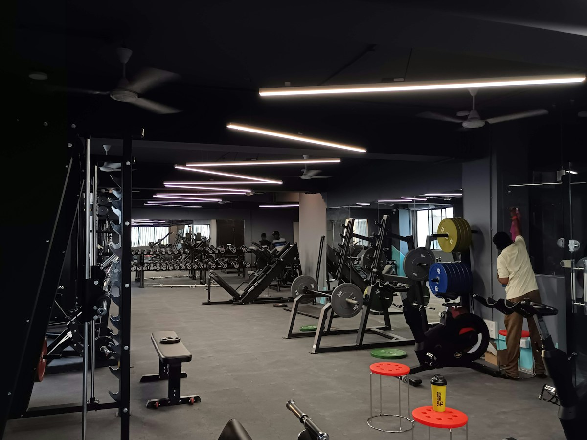 Gym interior with weight benches and exercise equipment